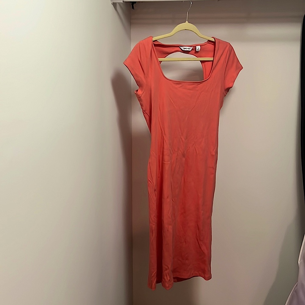 form fitting midi dress in coral.